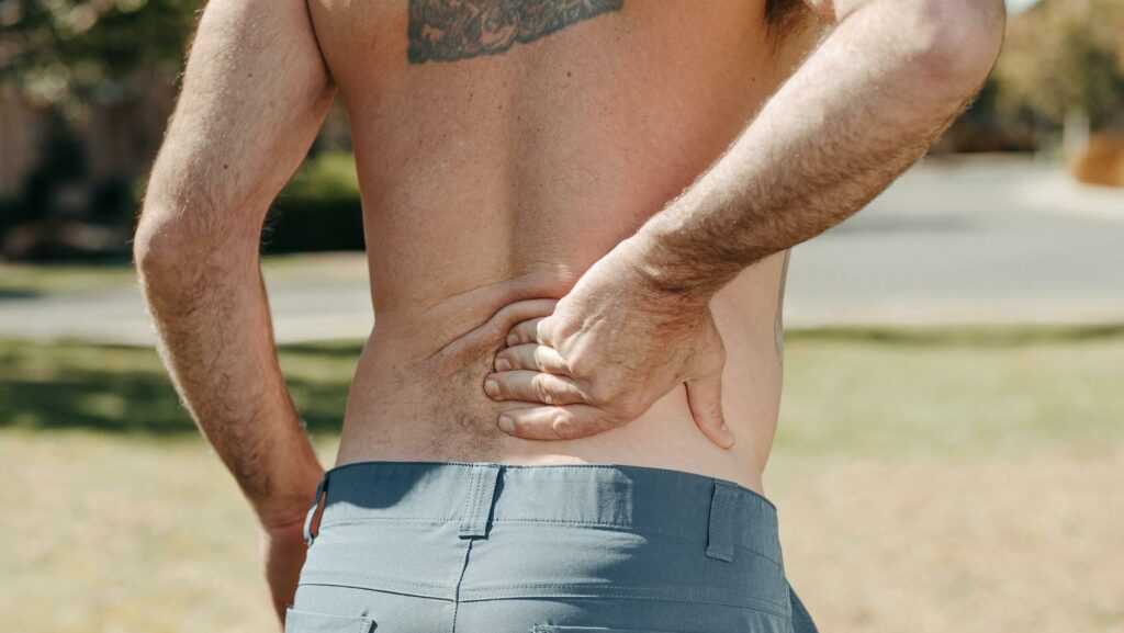 a man having lower back paint